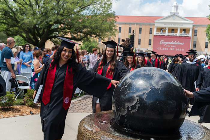 woman touching globe