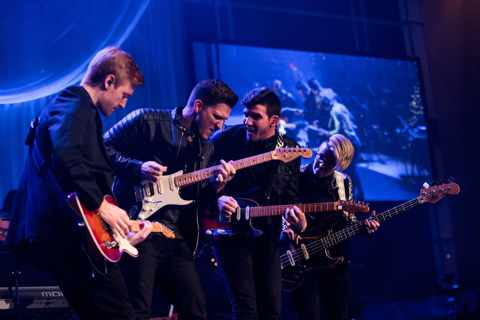 people playing guitars