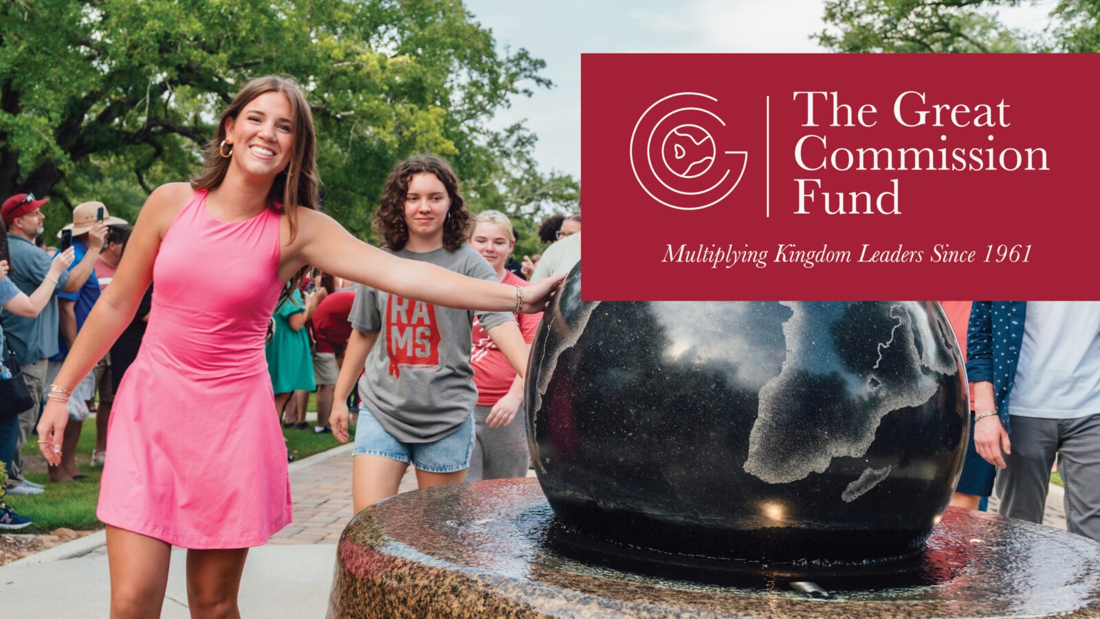 the great commission fund graphic - girl touching globe statue