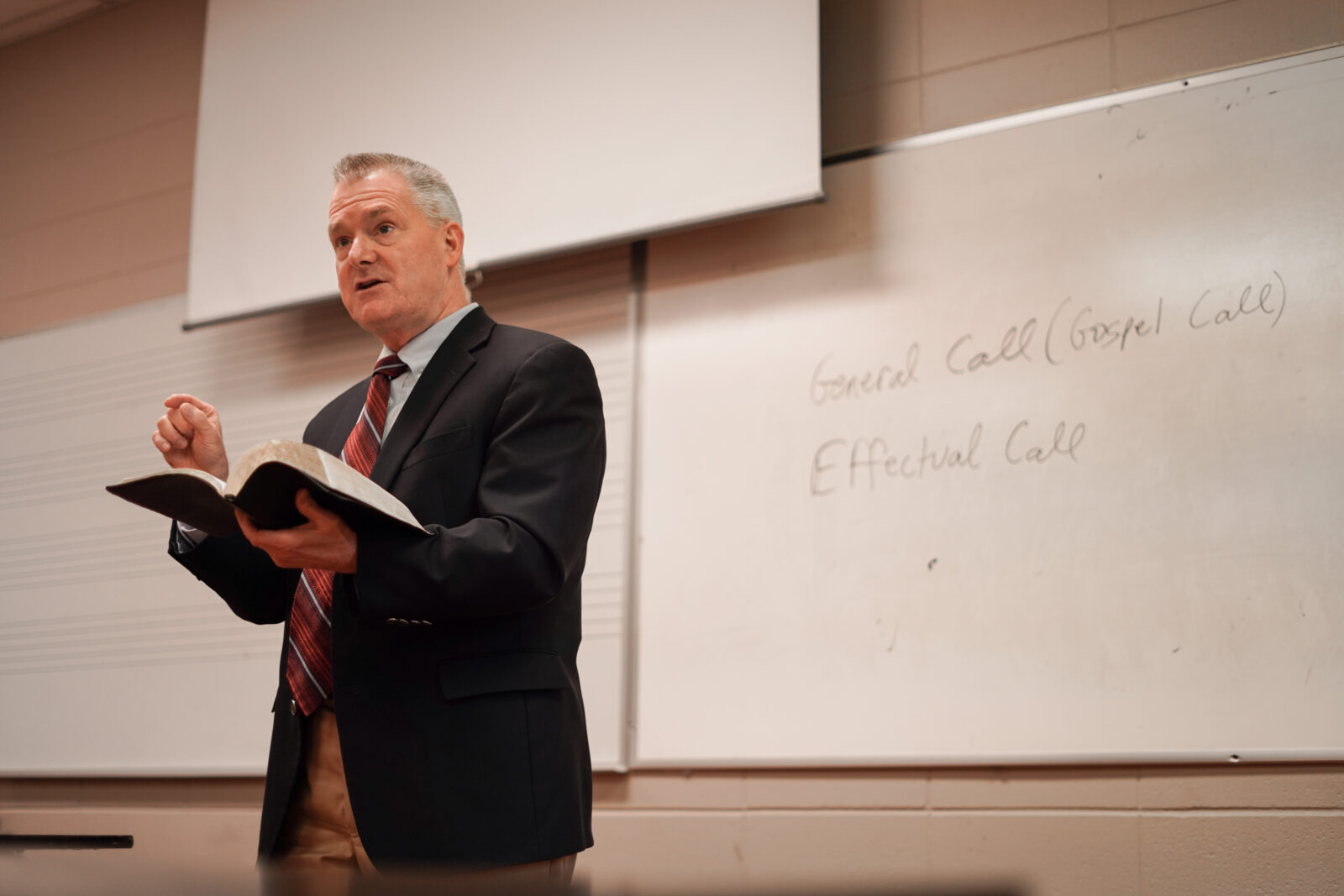 man speaking with bible