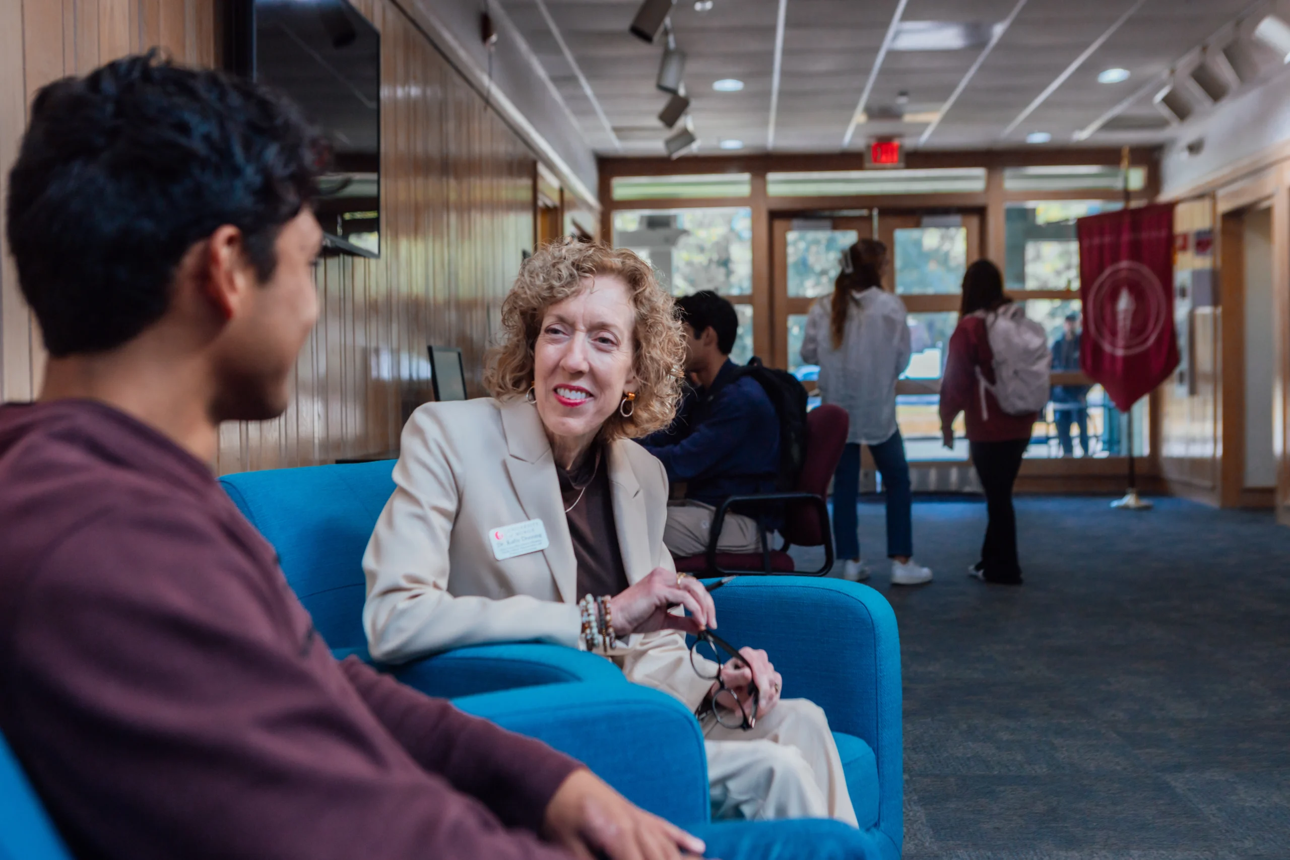 woman sitting with young man