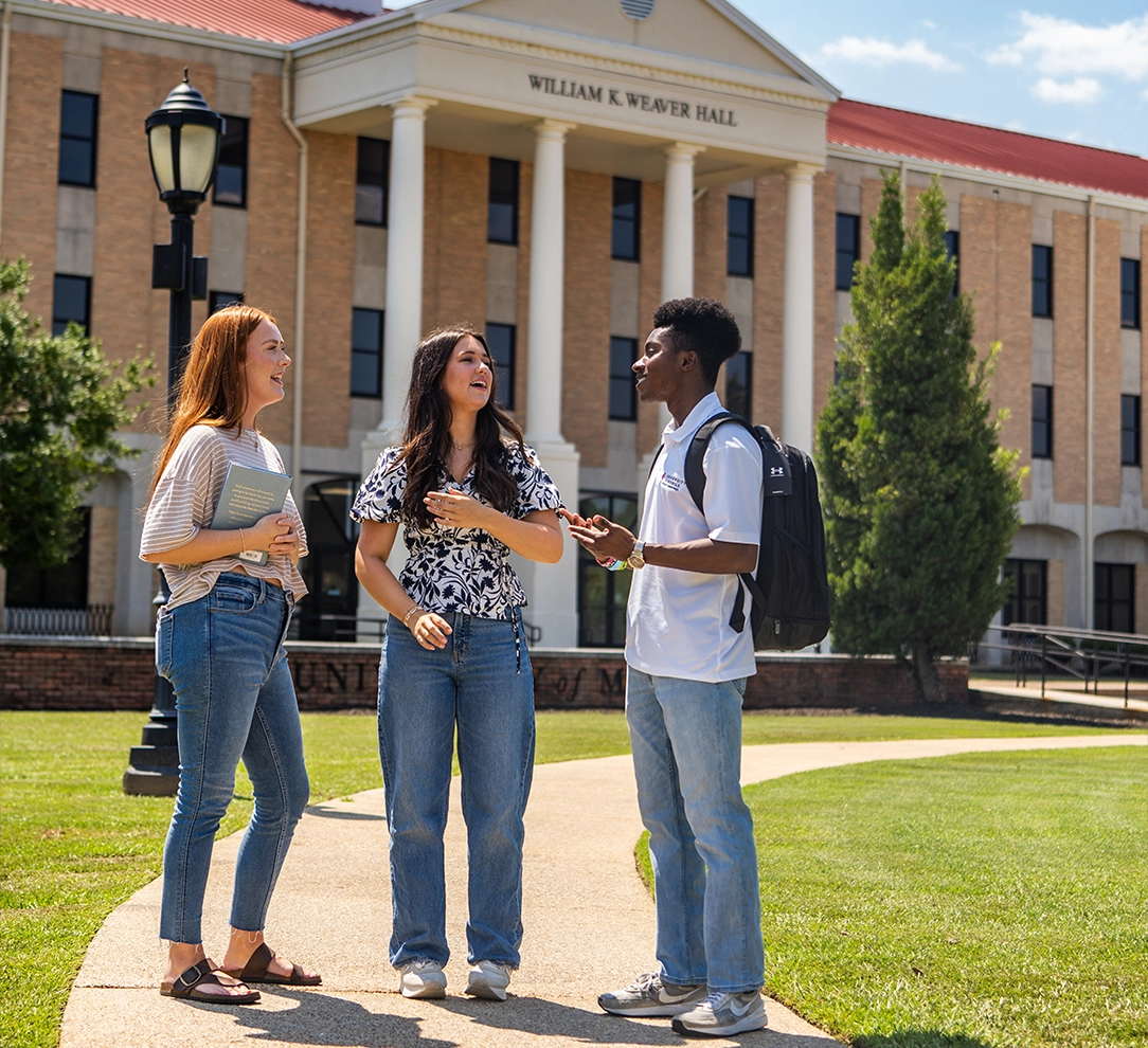 students talking outside