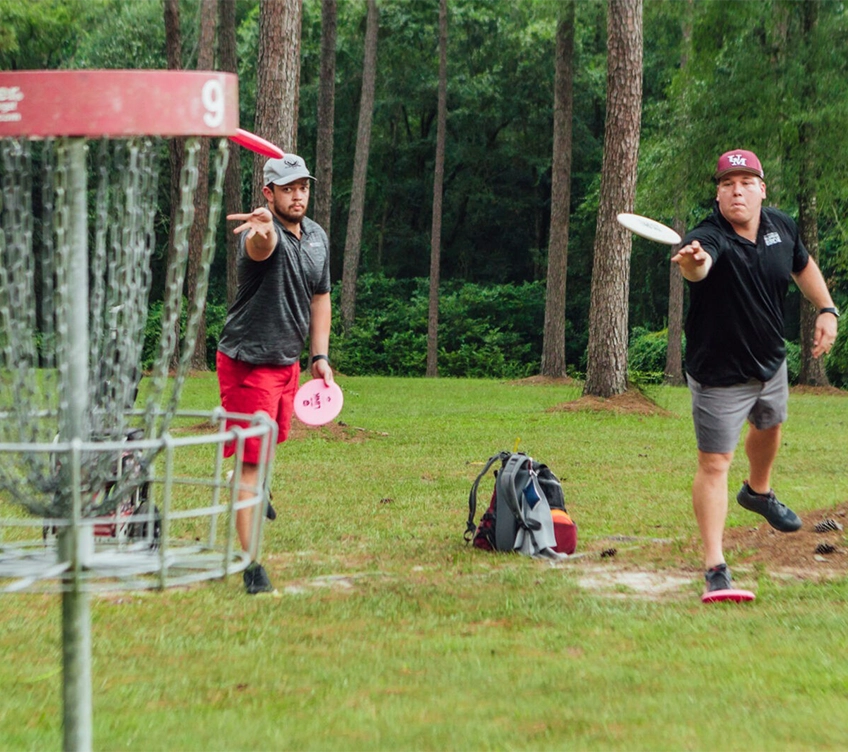 men playing disc golf
